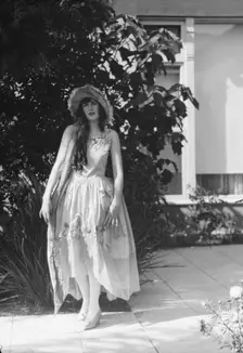 Barnett, Sally, Miss, standing outdoors, 1927 Creator: Arnold Genthe