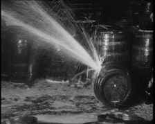 Barrels of Alcohol in a Cellar Being Destroyed During Prohibition, 1930. Creator: British Pathe Ltd