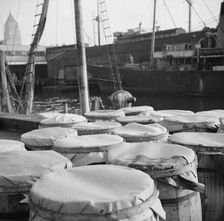 Barrels of fish on the docks at the Fulton fish market ready to be shipped to..., New York, 1943. Creator: Gordon Parks