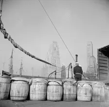 Barrels of fish on the docks at Fulton fish market ready to be shipped to..., New York, 1943. Creator: Gordon Parks