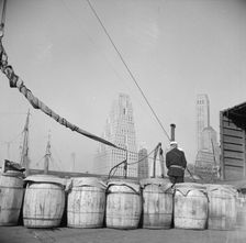 Barrels of fish on the docks at Fulton fish market ready to be shipped to..., New York, 1943. Creator: Gordon Parks