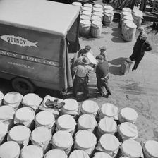 Barrels of fish on the docks at Fulton fish market ready to be shipped to retailers, New York, 1943. Creator: Gordon Parks