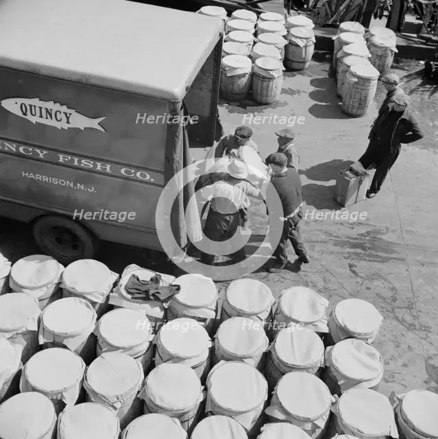 Barrels of fish on the docks at Fulton fish market ready to be shipped to retailers, New York, 1943. Creator: Gordon Parks.
