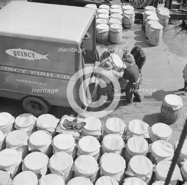 Barrels of fish on the docks at Fulton fish market ready to be shipped to retailers, New York, 1943. Creator: Gordon Parks.