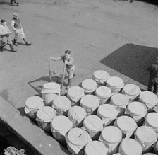 Barrels of fish on the docks at Fulton fish market ready to be shipped to retailers, New York, 1943. Creator: Gordon Parks