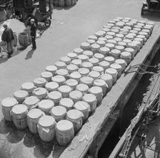 Barrels of fish on the docks at Fulton fish market ready to be shipped to retailers, New York, 1943. Creator: Gordon Parks