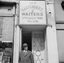 Bartenders and waiters club entrance in the Harlem area, New York, 1943. Creator: Gordon Parks