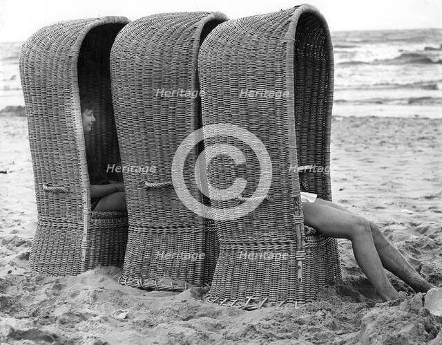 Basket shelters on a beach in Belgium, 1966. 