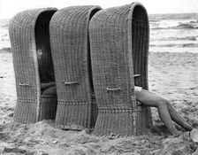 Basket shelters on a beach in Belgium, 1966