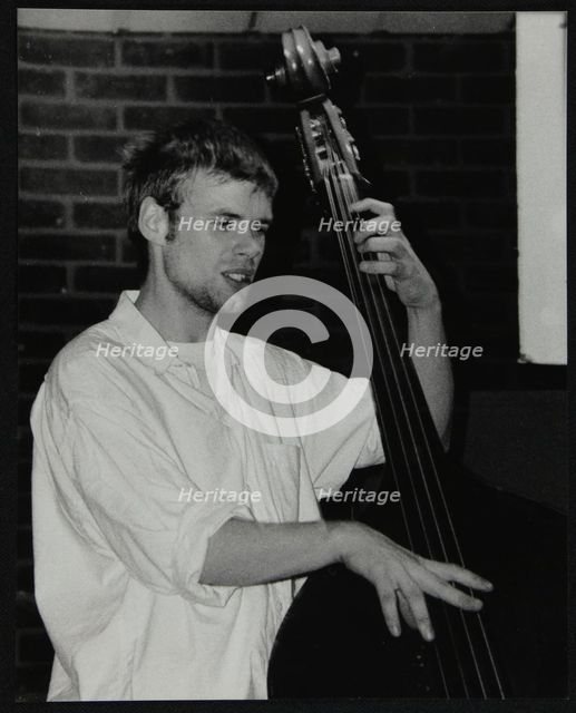 Bassist Ben Haselden playing at The Fairway, Welwyn Garden City, Hertfordshire, 8 April 2001. Artist: Denis Williams