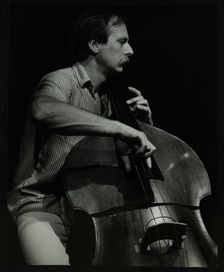 Bassist Paul Bridge playing at The Stables, Wavendon, Buckinghamshire. Creator: Denis Williams