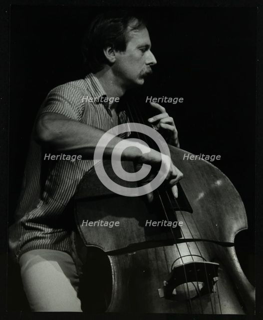 Bassist Paul Bridge playing at The Stables, Wavendon, Buckinghamshire. Creator: Denis Williams.