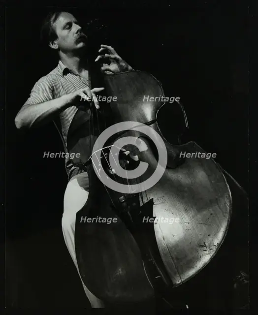 Bassist Paul Bridge playing at The Stables, Wavendon, Buckinghamshire. Creator: Denis Williams.