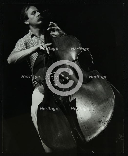 Bassist Paul Bridge playing at The Stables, Wavendon, Buckinghamshire. Creator: Denis Williams.