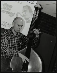 Bassist Simon Woolf playing at The Fairway, Welwyn Garden City, Hertfordshire, 2002. Creator: Denis Williams