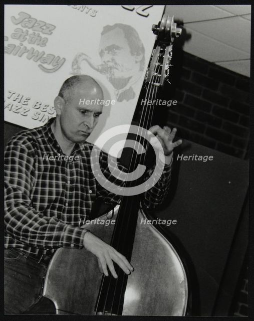 Bassist Simon Woolf playing at The Fairway, Welwyn Garden City, Hertfordshire, 2002. Creator: Denis Williams.