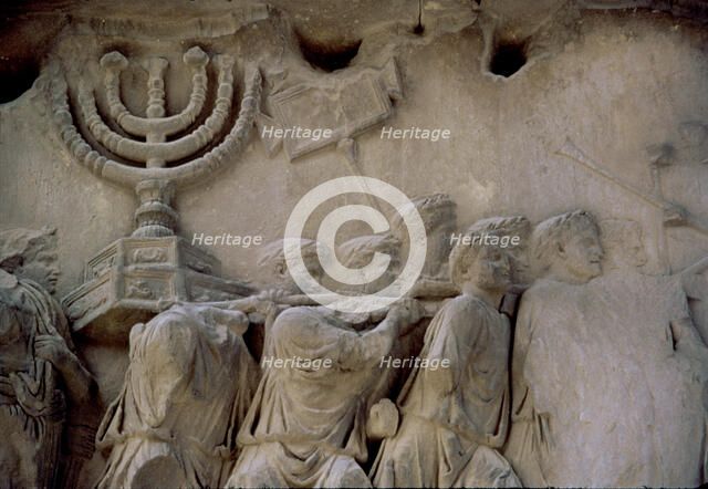 Basrelief in the Arch of Titus representing men carrying a menorah, located in the Via Sacra of t…
