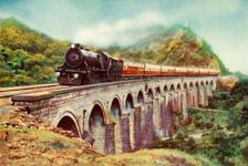 Between Bombay and Delhi. A striking view of the Frontier Mail passing over a viaduct 1935 Creator: Unknown