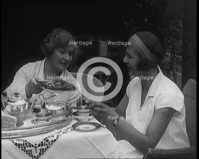 Betty May Nuthall Shoemaker, the British  World Top Female Tennis Player, Drinking Tea..., 1920. Creator: British Pathe Ltd.