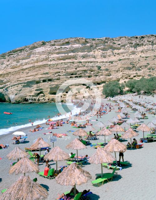 Beach and caves, Matala, Crete, Greece. Creator: Peter Thompson.