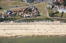 Beach huts on the sea front just below Gun Hill, Southwold, Suffolk, 2016. Creator: Damian Grady