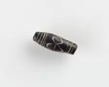 Bead, with a longitudinal bore. Cracked, 6th century. Creator: Unknown
