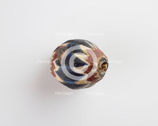 Bead, egg-shaped, with chamfered sides. Two sides chipped away, 13th-14th centuries. Creator: Unknown.