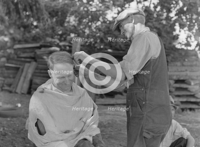 Bean pickers barbering each other, near West Staten, Marion County, Oregon, 1939. Creator: Dorothea Lange.