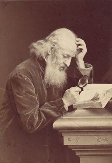 [Bearded Man with Magnifying Glass Examining a Manuscript], 1870s. Creator: Antoine-Samuel Adam-Salomon