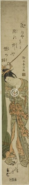 Beauty Looking Down at a Cat while Fixing a Mosquito Net, c. 1760/63. Creator: Suzuki Harunobu.