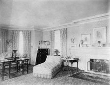 Bedroom with fireplace, and padded chaise longue, in home of...Greenwich, Connecticut, 1908. Creator: Frances Benjamin Johnston