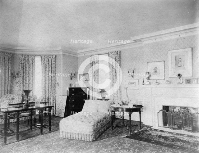 Bedroom with fireplace, and padded chaise longue, in home of...Greenwich, Connecticut, 1908. Creator: Frances Benjamin Johnston.