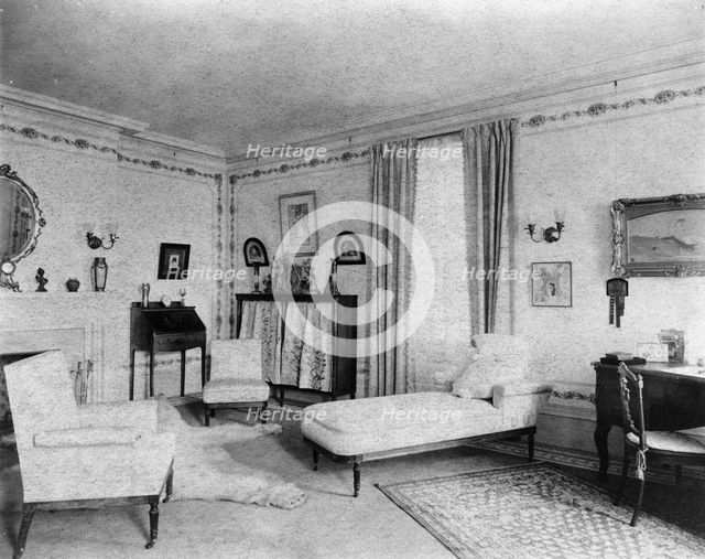 Bedroom with fireplace, padded chaise longue, window, and polar..., Greenwich, Connecticut, 1908. Creator: Frances Benjamin Johnston.