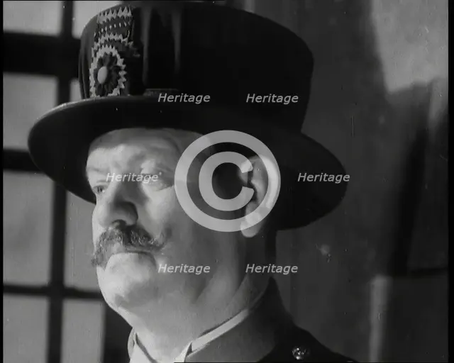 Beefeater guarding the Crown Jewels at the Tower of London, 1937.  Creator: British Pathe Ltd.