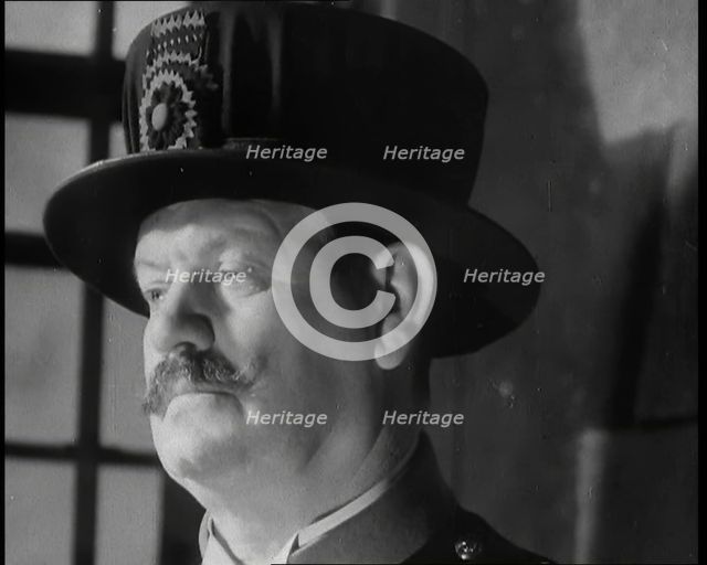 Beefeater guarding the Crown Jewels at the Tower of London, 1937.  Creator: British Pathe Ltd.