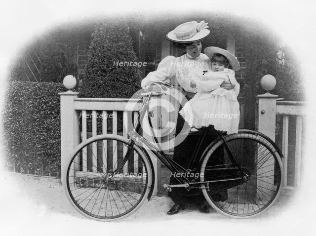 Beeston Humber cycle, Mrs. Hicks with child. Creator: Unknown.