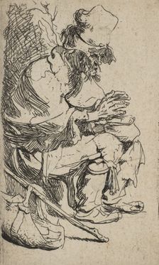Beggar Seated Warming His Hands at a Chafing Dish, ca. 1630., ca. 1630. Creator: Rembrandt Harmensz van Rijn
