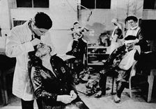 Behind The Lines Were Many Workers. With the blitz still at its height, casualties are attended to