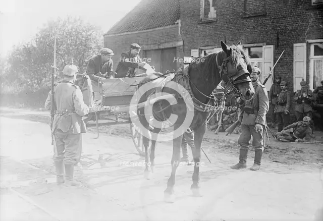 Belgian peasants showing pass to sentries, between 1914 and c1915. Creator: Bain News Service.