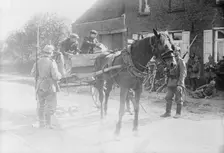 Belgian peasants showing pass to sentries, between 1914 and c1915. Creator: Bain News Service