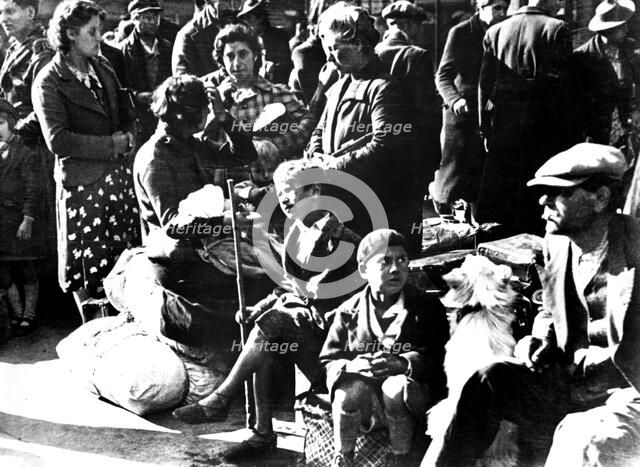 Belgian refugees with their bicycles and possessions outside the Gare du Nord, Paris, July 1940. Artist: Unknown