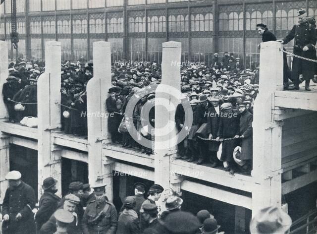 Belgian refugees on the harbour at Ostend waiting for a boat to take them to England, 1914.