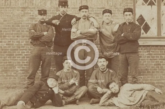 Belgian soldiers posing for a group portrait in a casual manner, 1908. Creator: Unknown.