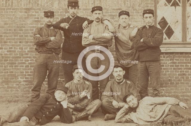 Belgian soldiers posing for a group portrait in a casual manner, 1908. Creator: Unknown.