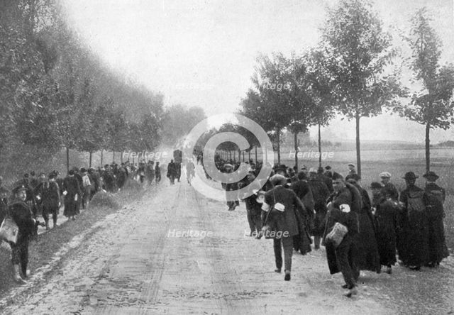 Belgians fleeing from Termonde, First World War, 1914, (1920). Artist: Unknown