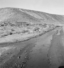 Below the bench, showing condition of road which..., Dead Ox Flat, Malheur County, Oregon, 1939. Creator: Dorothea Lange