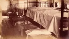 Bellevue Hospital, New York City: a dormitory with bunk beds, 1885-1898. Creator: Unknown