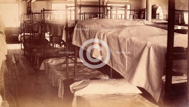 Bellevue Hospital, New York City: a dormitory with bunk beds, 1885-1898. Creator: Unknown.