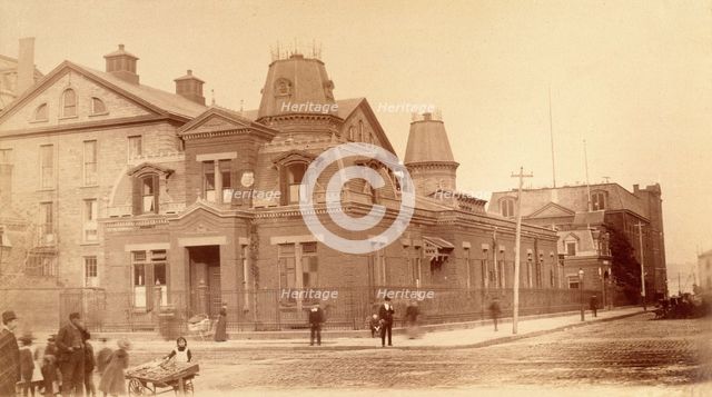 Bellevue Hospital, New York City: a street corner with hospital buildings and people, 1885-1898. Creator: Unknown.