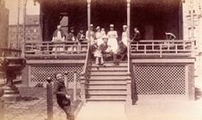 Bellevue Hospital, New York City: children patients, nurses and doctors sitting on a balcony in... Creator: Unknown